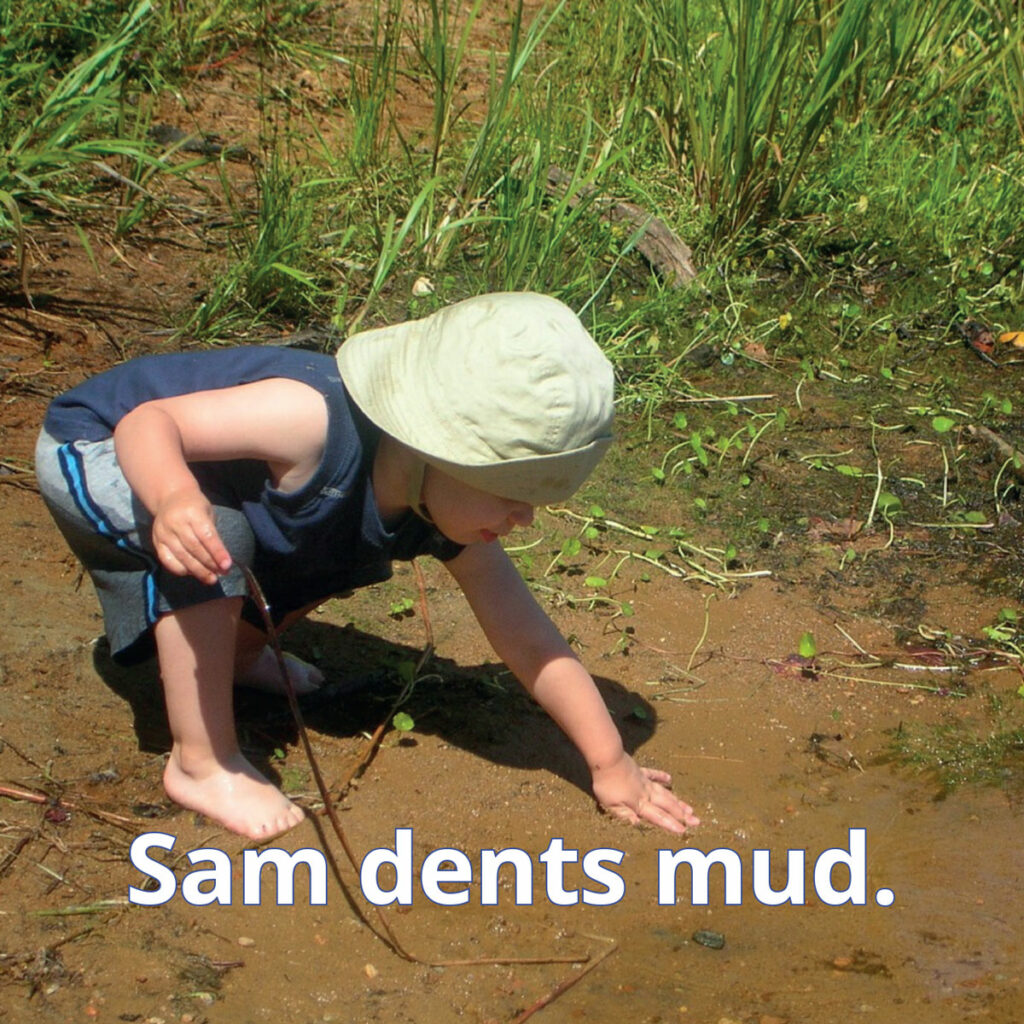 Mud reader image of small child touching mud